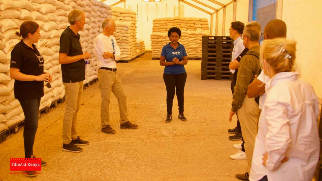 WFP staff briefing the IOAC members on warehouse activity. Photo: FilmAid Kenya