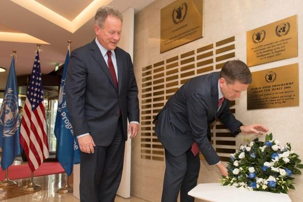 Mr Mark Green, Administrator of USAID, lays a wreath at the WFP Memorial Wall. Photo Credit: WFP/Rein Skullerud