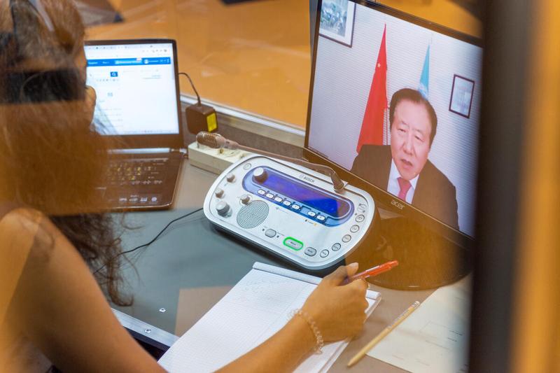 WFP HQ Rome, Italy, 21 June 2021 - In the Photo: interpreter at work during the intervention by H.E. Mr. Guang Defu, Ambassador and Permanent Representative of the People’s Republic of China - (connected remotely). - Photo: WFP/Giulio D'Adamo