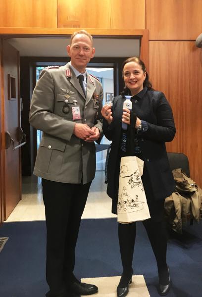 Colonel Henning Weeke, leader of the National General/Admiral Staff Officer Course at the Academy, receiving WFP visibility items, including a WFP water dopper piloted by the Executive Board Secretariat as part of the Greening the EB Initiative. Photo: WFP/Rina Manzo