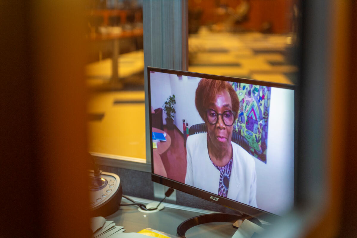 Interpreter at work during the intervention by  Ms. Joyce Luma, United Nations World Food Programme Human Resources Director - (connected remotely). Photo: WFP/Giulio d'Adamo